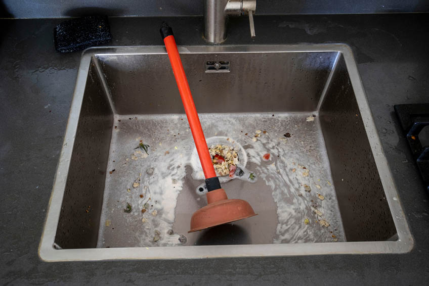 Overflowing kitchen sink