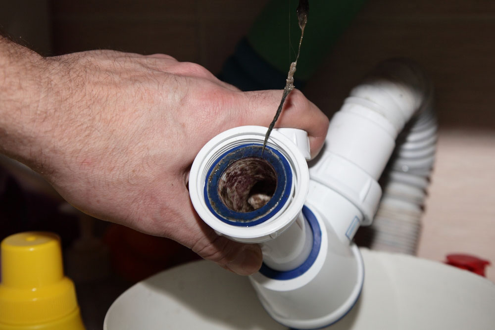 Clogged plastic water trap siphon and drainage pipe Lawrenceburg, KY